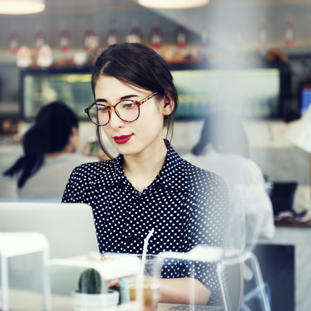 Young Woman Browsing Internet Laptop Concept